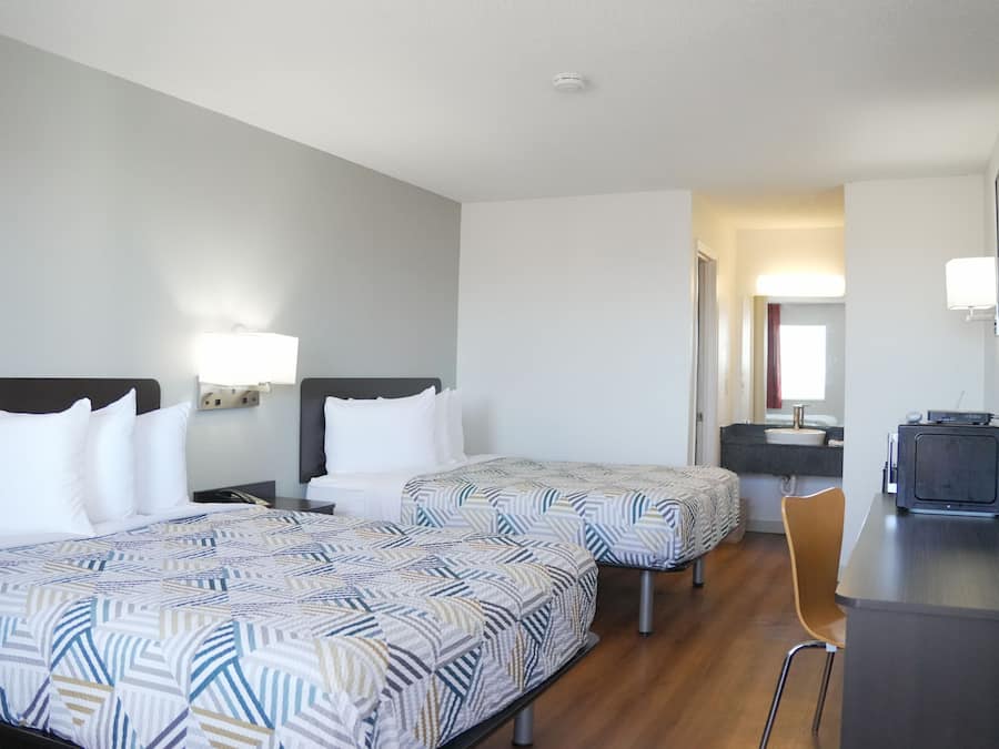 Deluxe Room, 2 Queen Beds, Non Smoking, Refrigerator & Microwave | WiFi (free), bed sheets