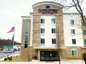 A hotel with a stone facade, multiple windows, and a sign reading "Candlewood Suites". - Candlewood Suites Belle Vernon by IHG (Belle Vernon)