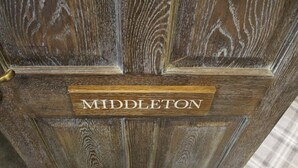 A wooden door with a sign that reads "MIDDLETON".