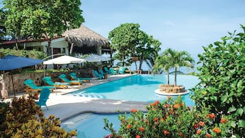 Outdoor pool, open 6:00 AM to 11 PM, pool umbrellas, pool loungers