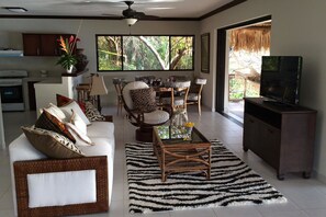Luxury Villa, 1 King Bed, Living Room, Ocean View | Living area | 42-inch flat-screen TV with satellite channels, TV, foosball