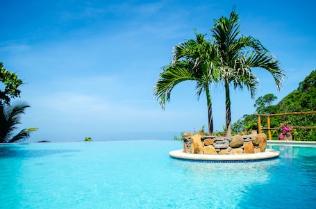 Outdoor pool, open 6:00 AM to 11 PM, pool umbrellas, sun loungers