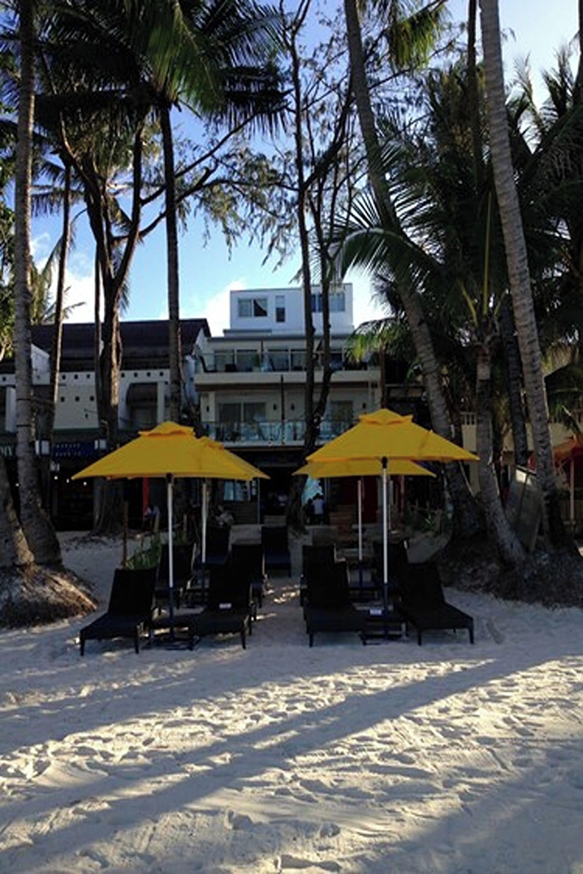 on the beach, white sand, sun-loungers, beach umbrellas
