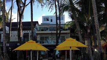 On the beach, white sand, sun-loungers, beach umbrellas