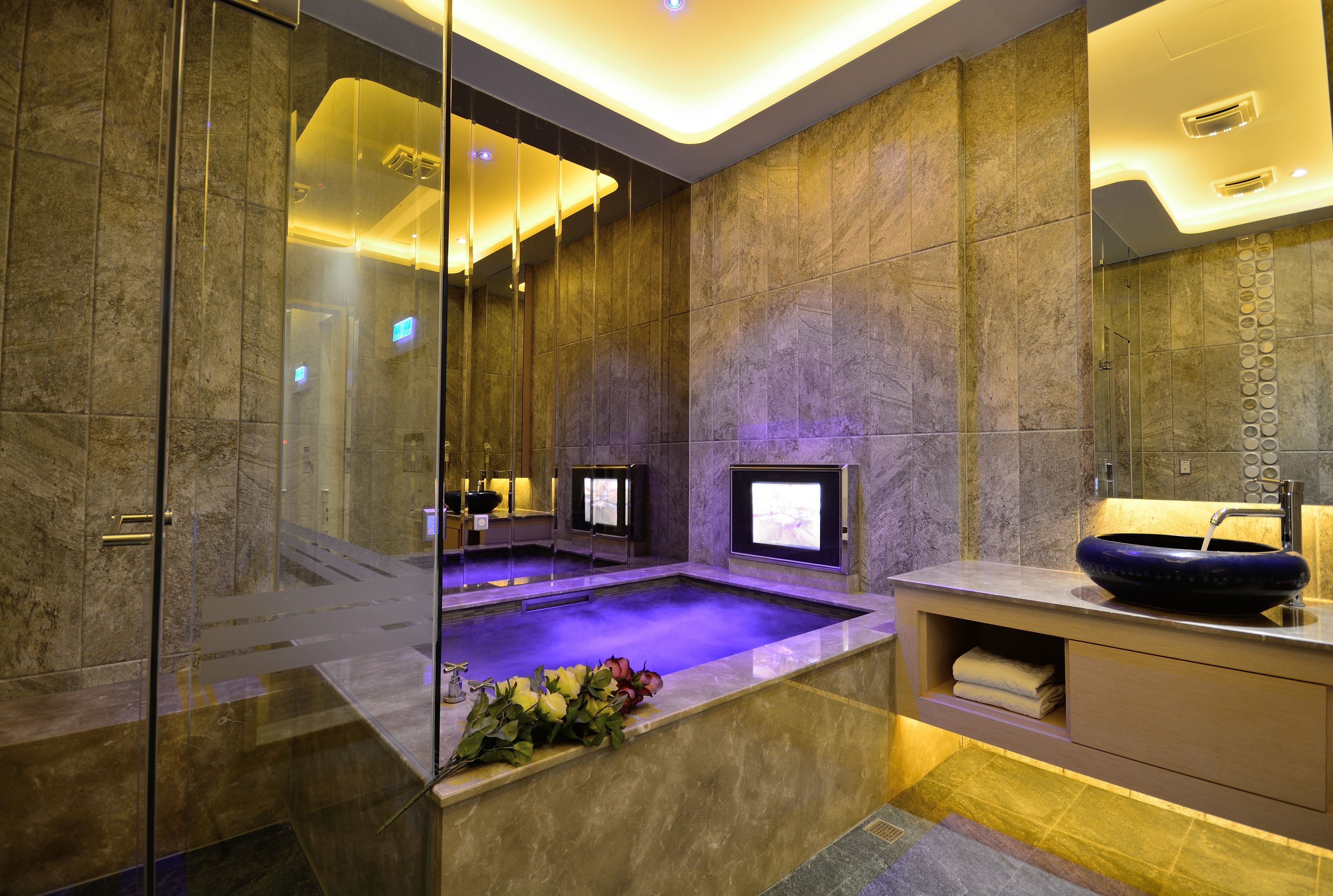 Separate bathtub and shower, hair dryer, slippers, towels