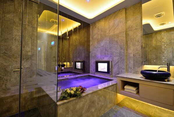 Separate tub and shower, hair dryer, slippers, towels