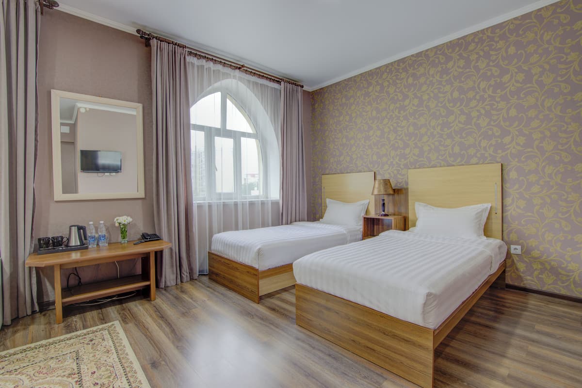 standard twin room | premium bedding, in-room safe, desk, iron/ironing board