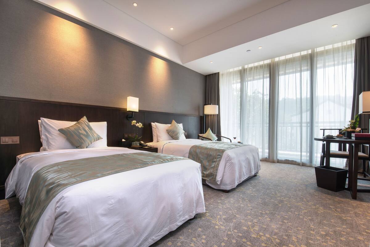 Eenvoudige kamer | Luxe beddengoed, donsdekens, een gratis minibar, een kluis op de kamer