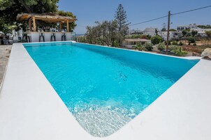 Outdoor pool, open 8:00 AM to 8:30 PM, pool umbrellas