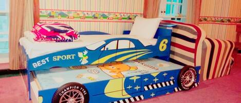 A children's bed with a sports theme, featuring a cartoon character and the words "BEST SPORT".