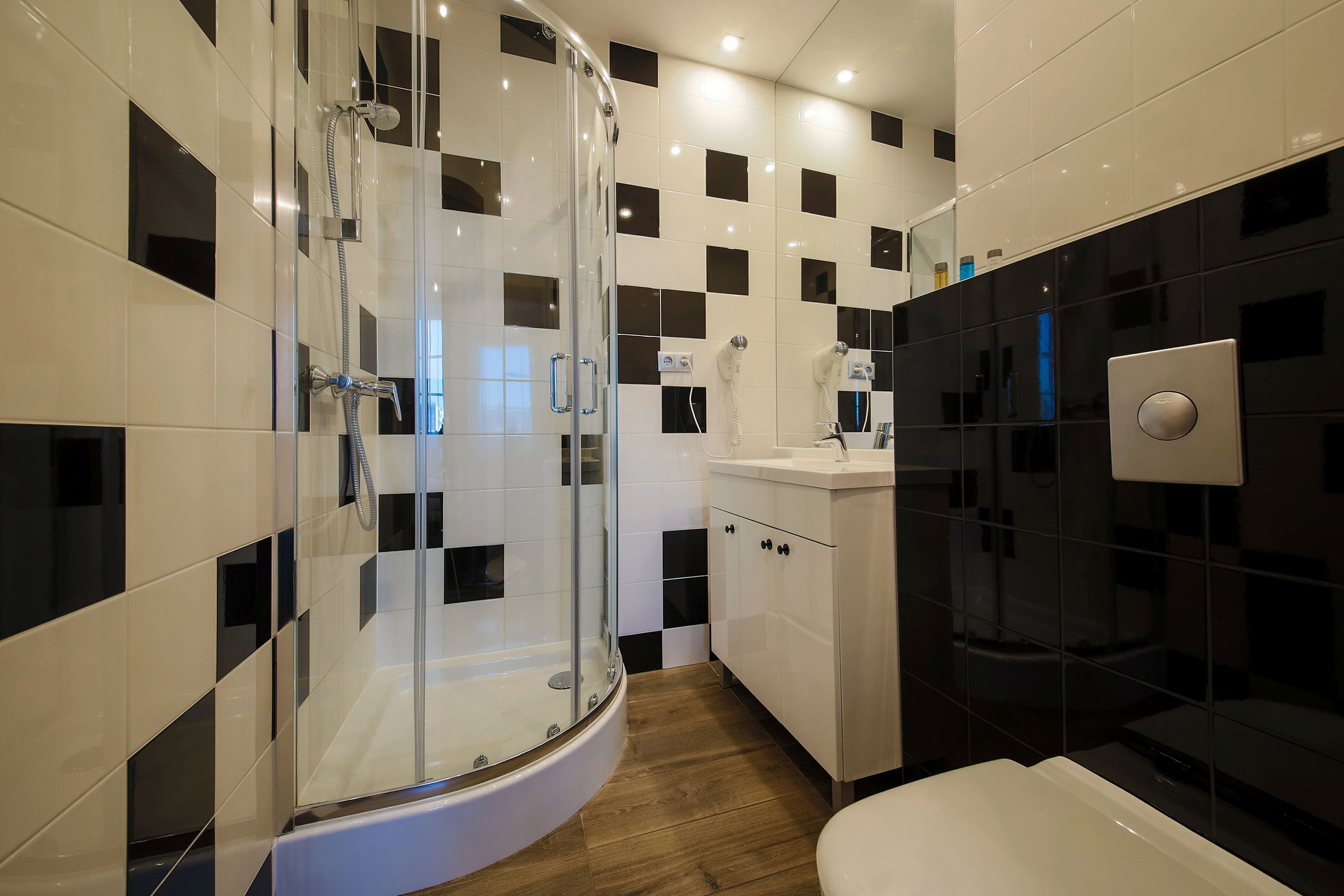 deluxe apartment | bathroom | shower, hair dryer, towels