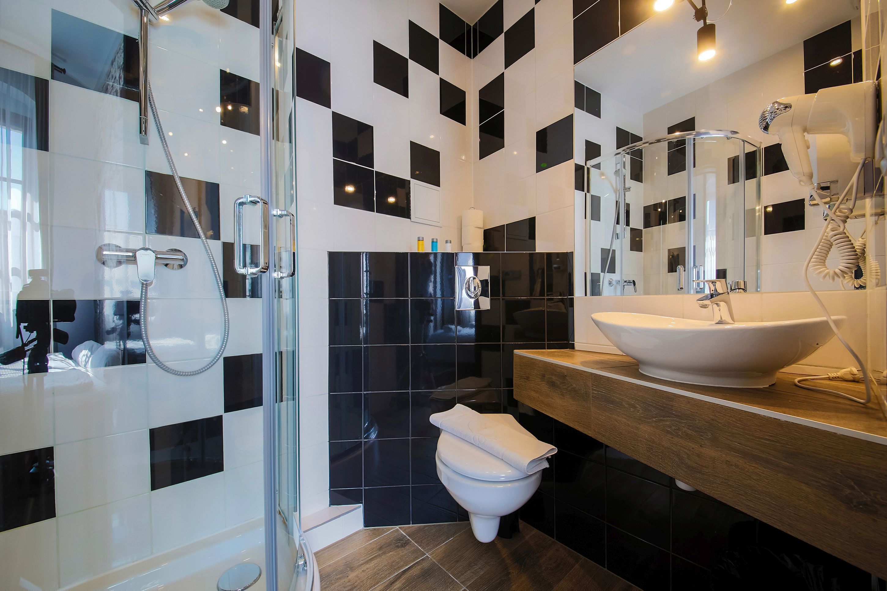 deluxe apartment | bathroom | shower, hair dryer, towels