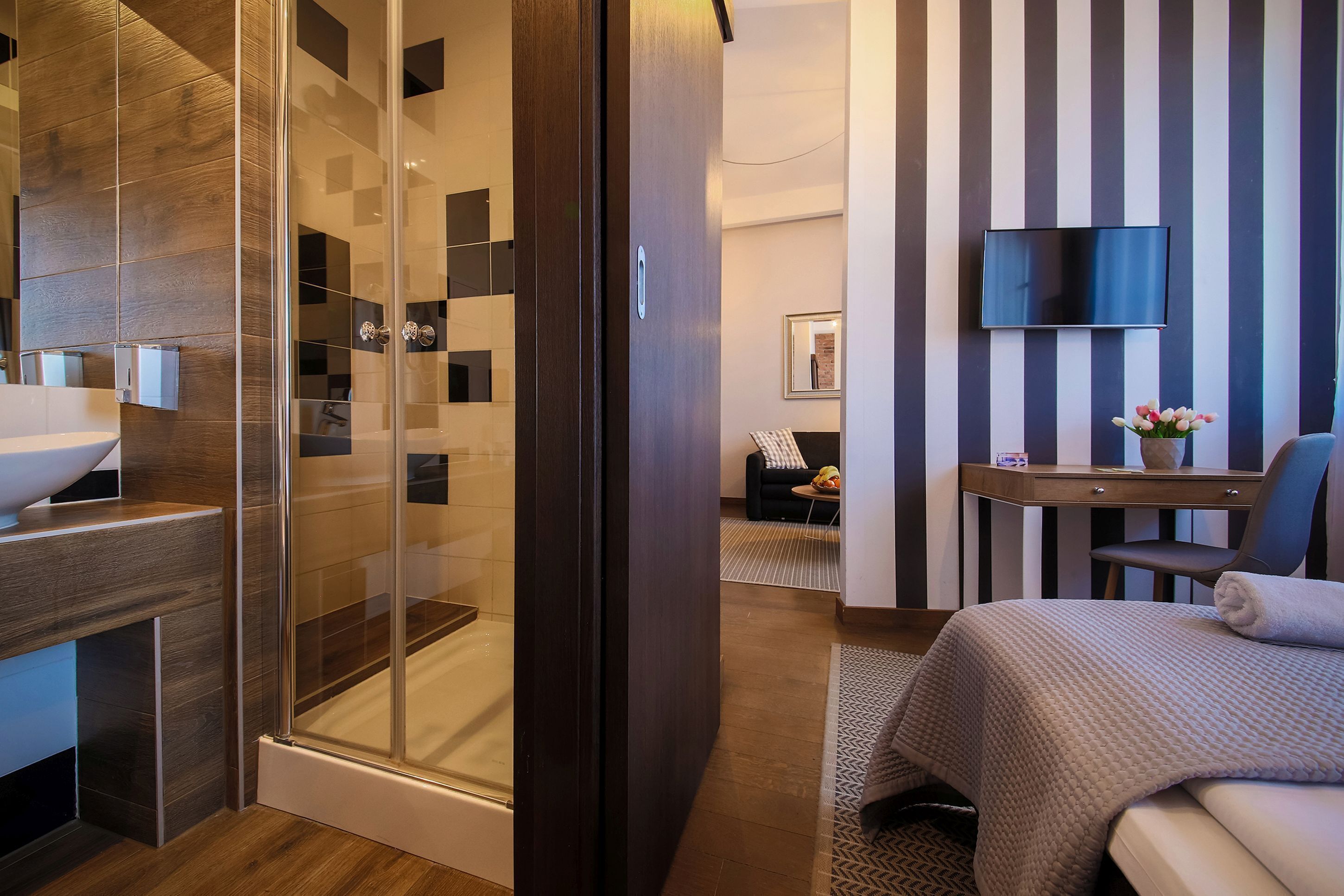 deluxe apartment | living area | flat-screen tv