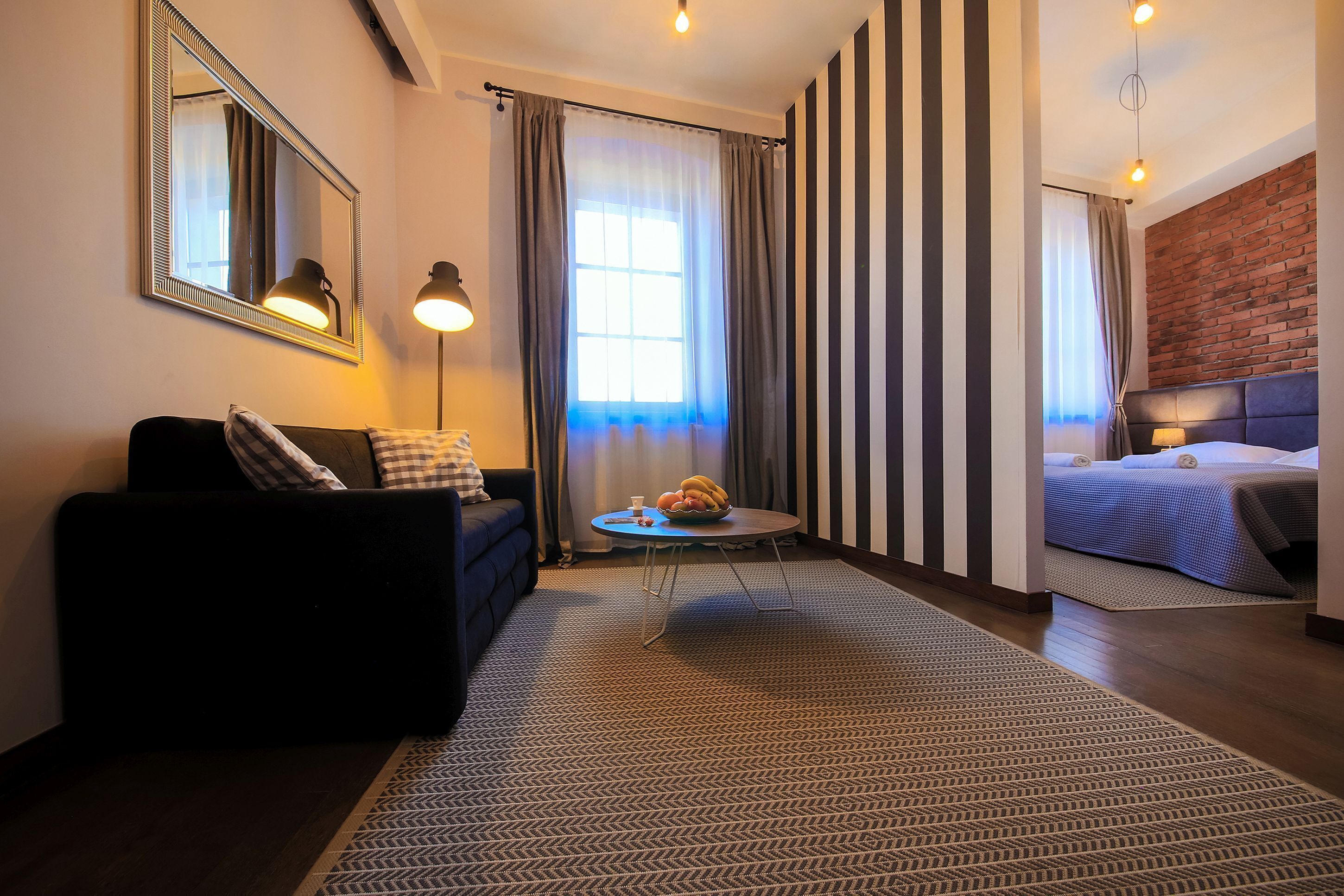 deluxe apartment | living area | flat-screen tv