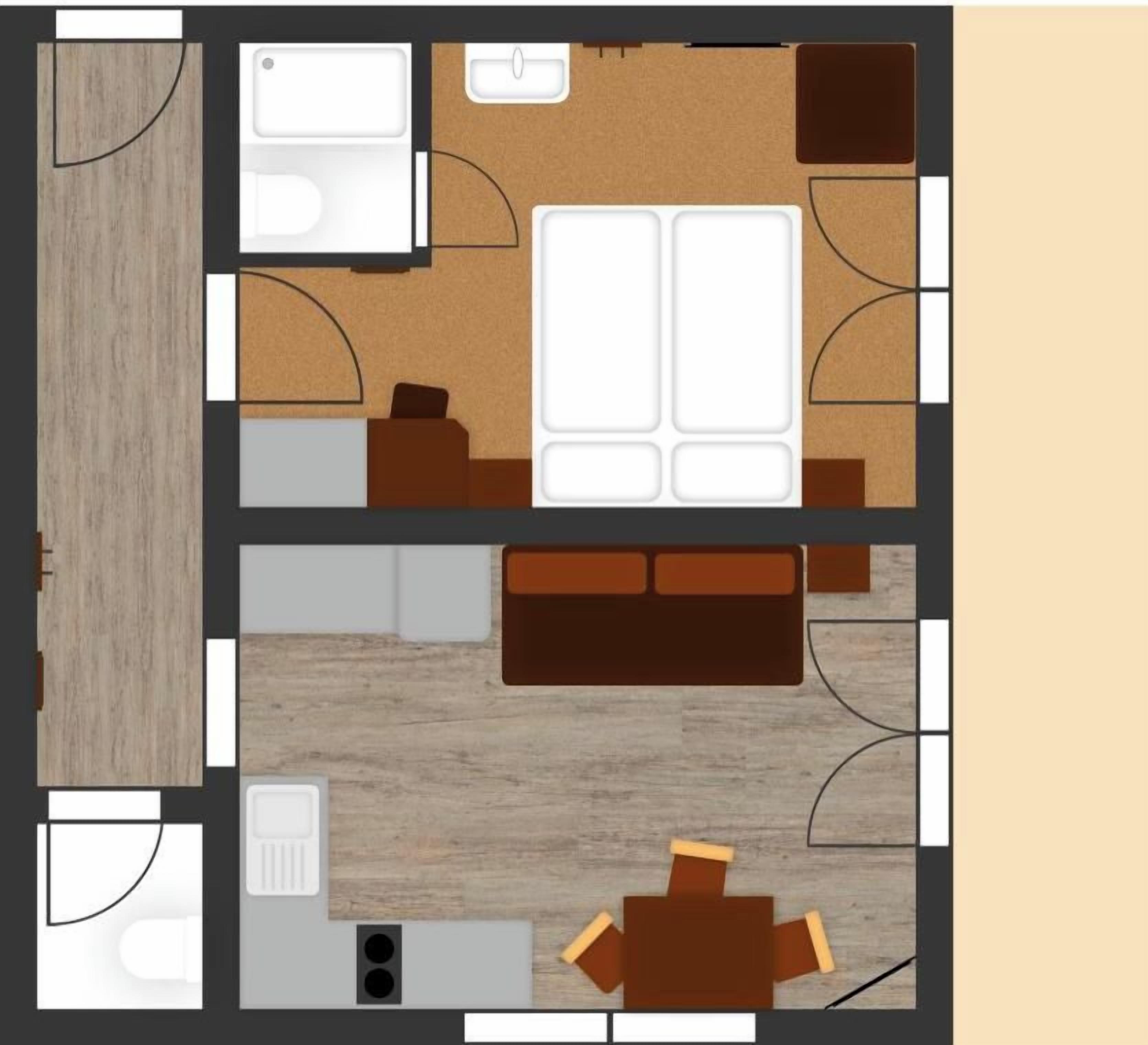 A hotel room layout with a kitchenette, a seating area, and a bathroom.