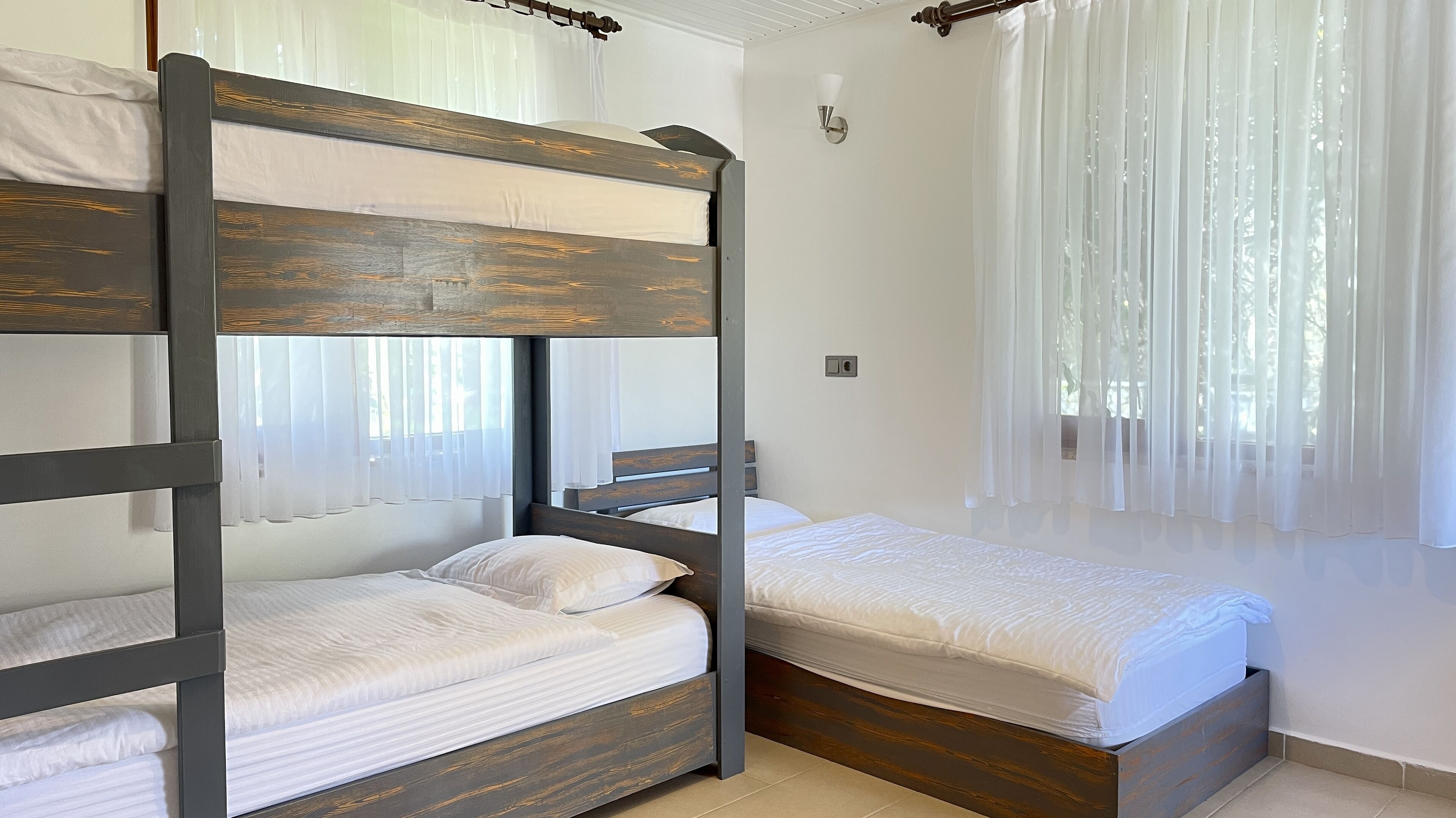 family room | 1 bedroom, minibar, in-room safe, individually decorated