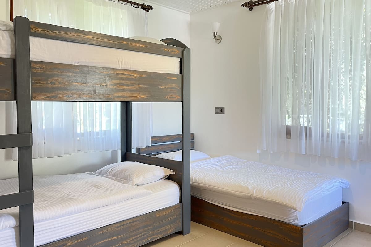 family room | 1 bedroom, minibar, in-room safe, individually decorated