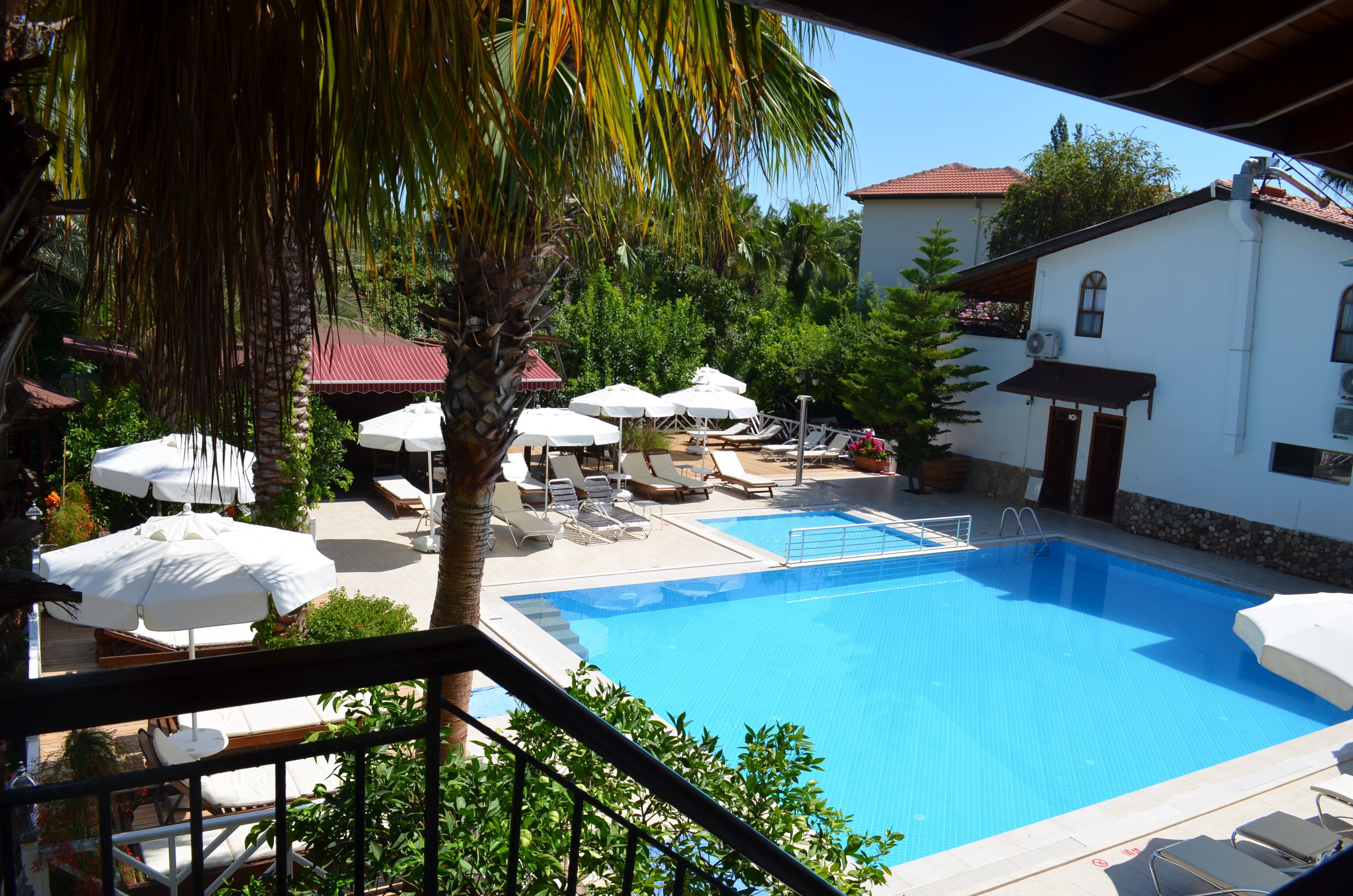 outdoor pool, pool umbrellas, pool loungers