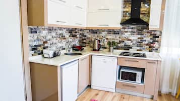 Apartment, Ground Floor | Private kitchen | Fridge, microwave, stovetop, dishwasher