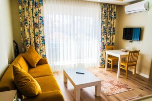 Apartment, Ground Floor | Living room | LCD TV - Ale Apartments Hotel (Konyaalti)