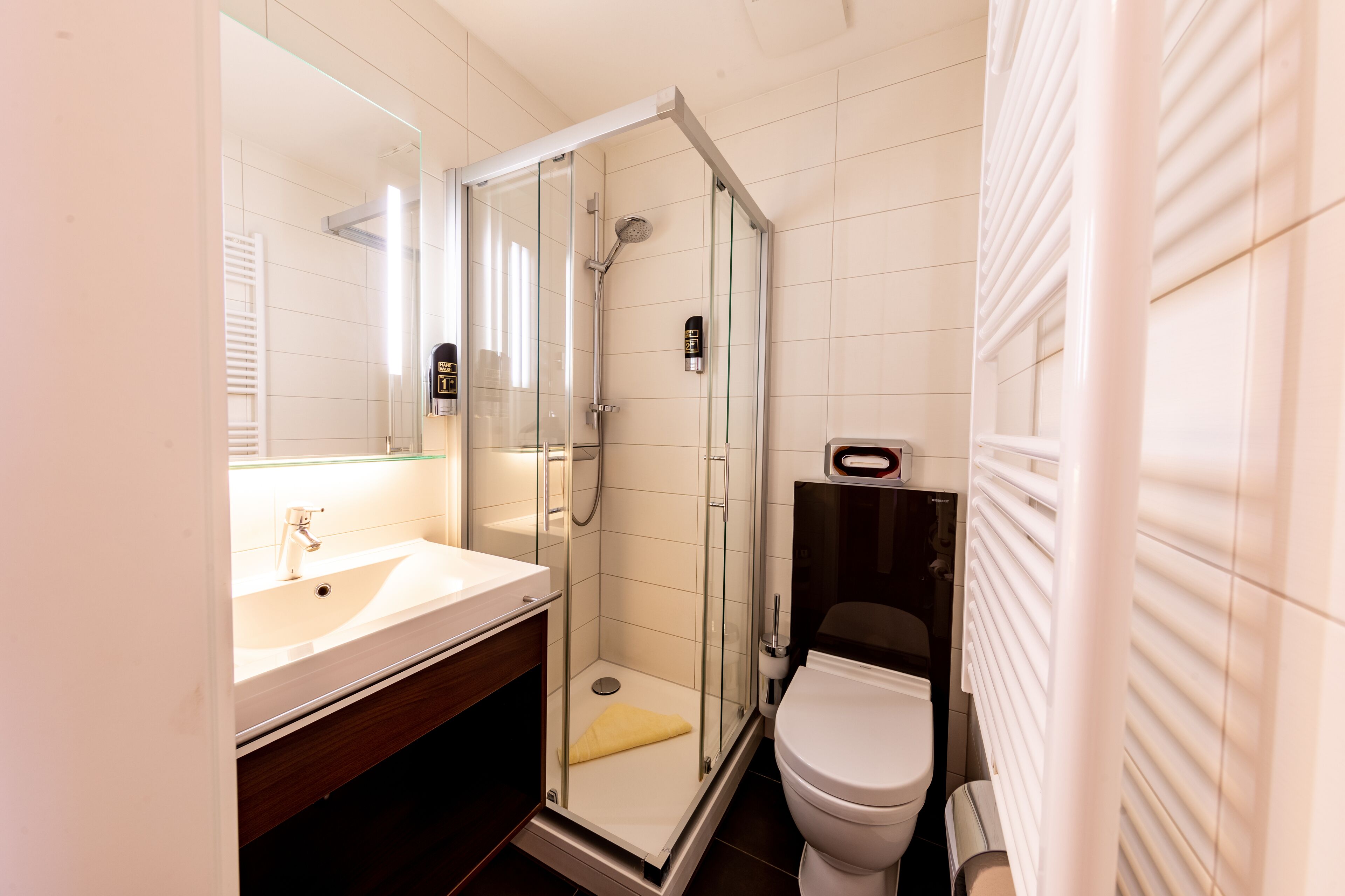 shower, free toiletries, hair dryer, towels