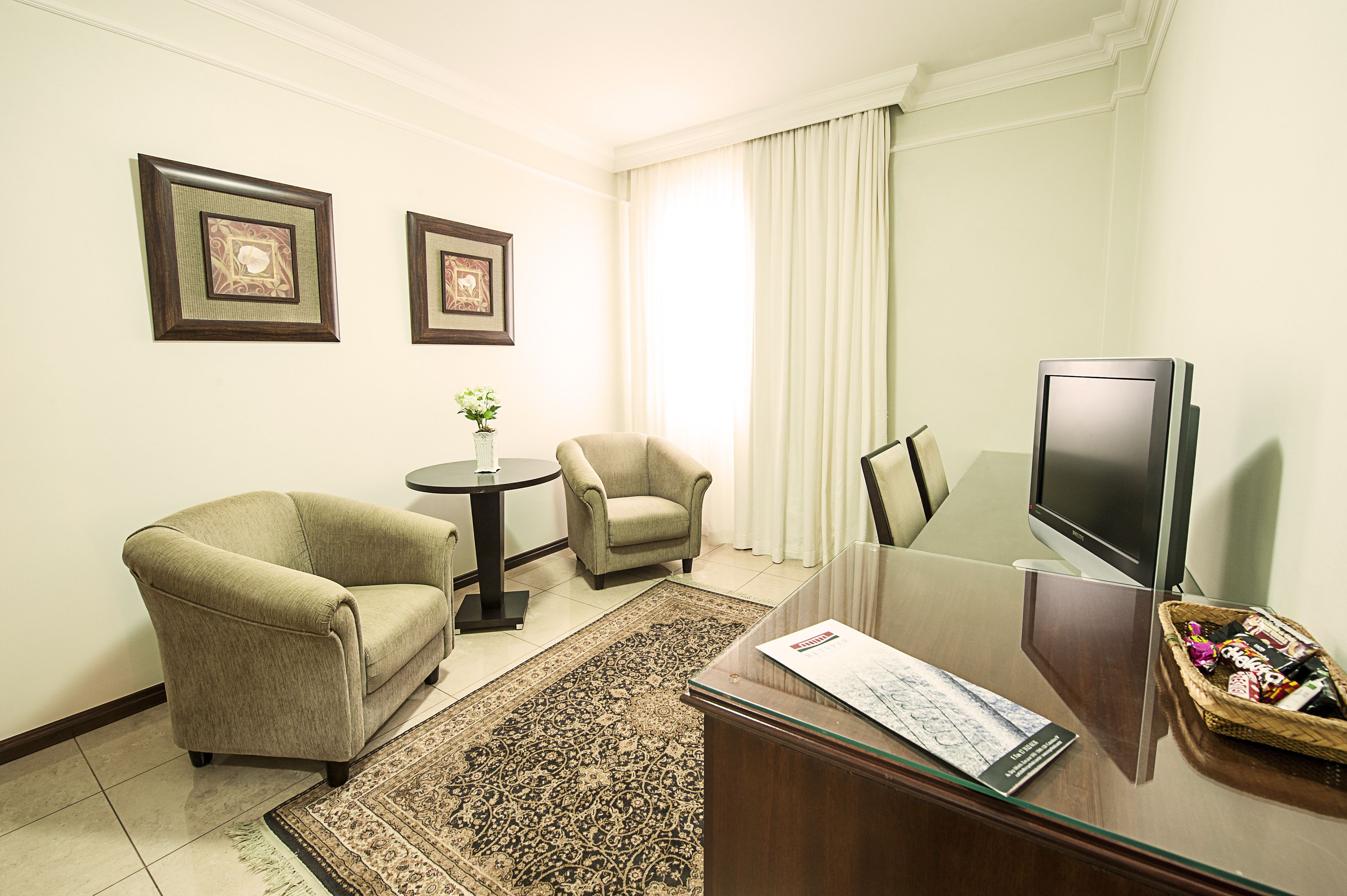 suite | living room | 32-inch flat-screen tv with cable channels, tv