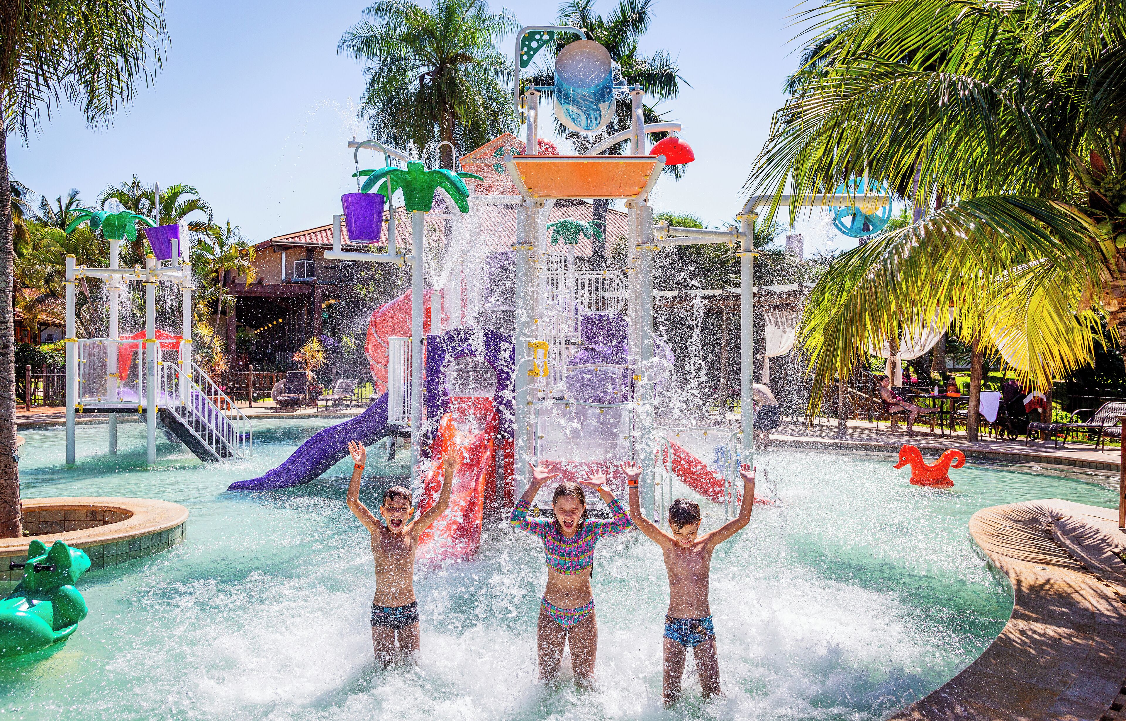A water park with a large water slide and multiple water features.