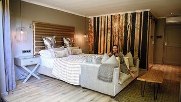 Superior suite, 1 kingsize bed, uitzicht op tuin | Luxe beddengoed, een minibar, een kluis op de kamer