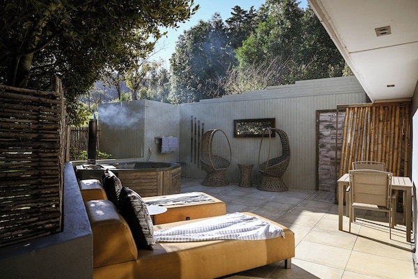 Deluxe Suite, 1 King Bed, Courtyard View, Garden Area | Premium bedding, minibar, in-room safe, individually decorated