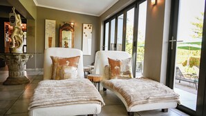 A modern bedroom with two beds, a large window, and a view of the outdoors. - Silver Forest Boutique Hotel, Spa, Restaurant & Bar (Cape Town)