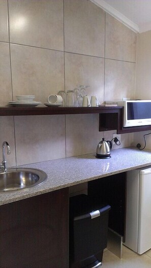Fridge, microwave, coffee/tea maker, electric kettle
