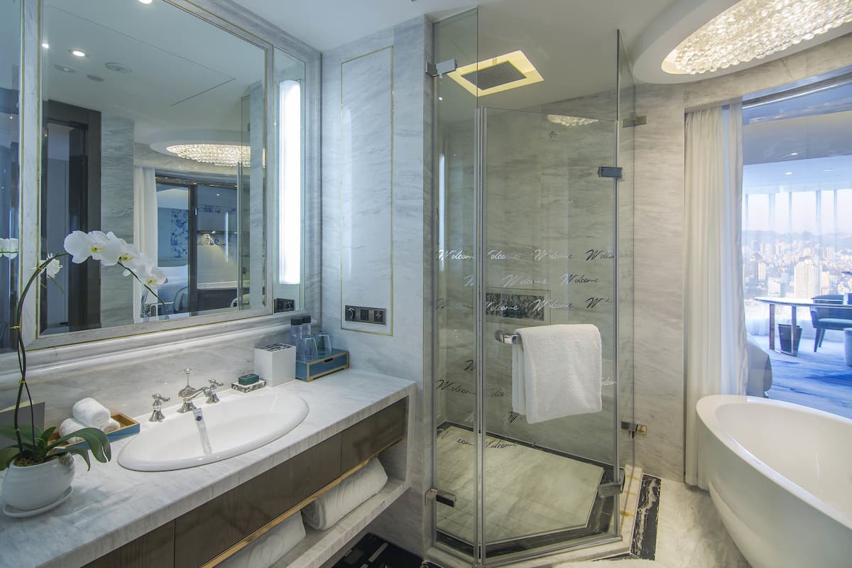 separate bathtub and shower, rainfall showerhead, designer toiletries