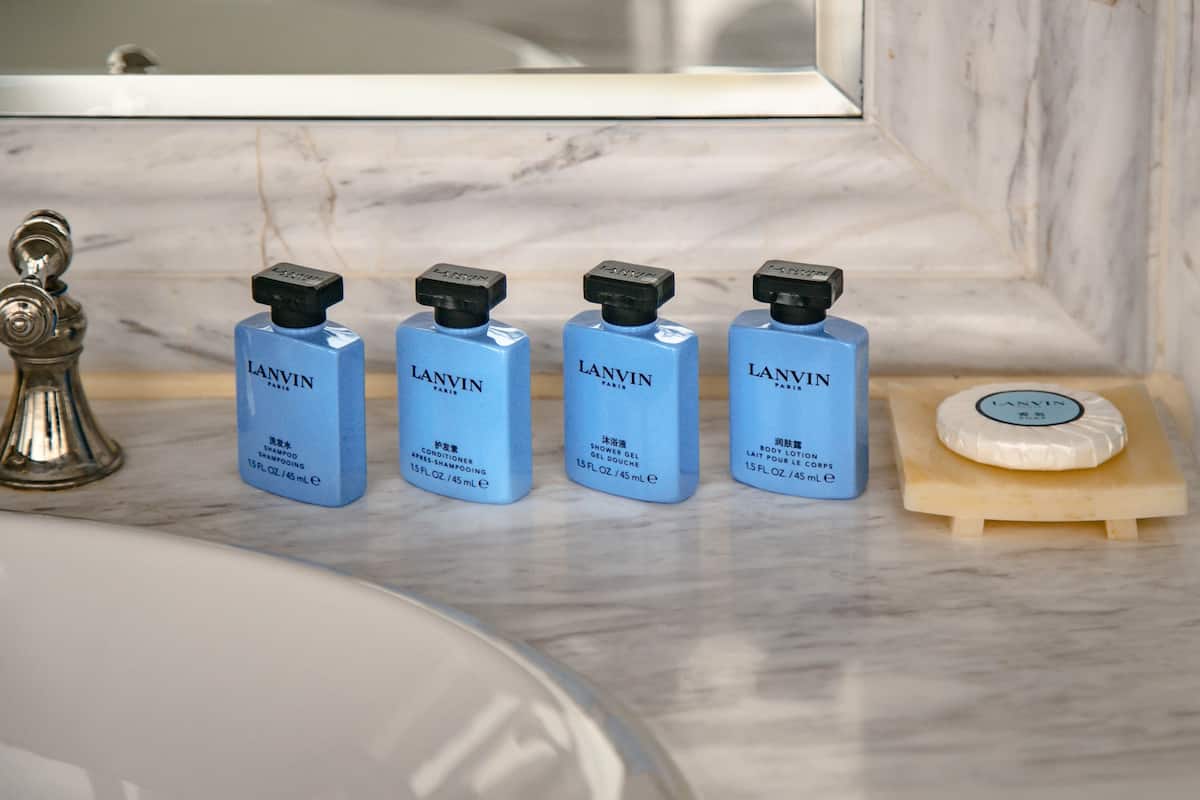 separate bathtub and shower, rainfall showerhead, designer toiletries