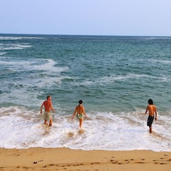 On the beach, white sand, sun-loungers, beach umbrellas