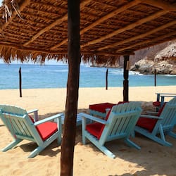 On the beach, white sand, sun-loungers, beach umbrellas