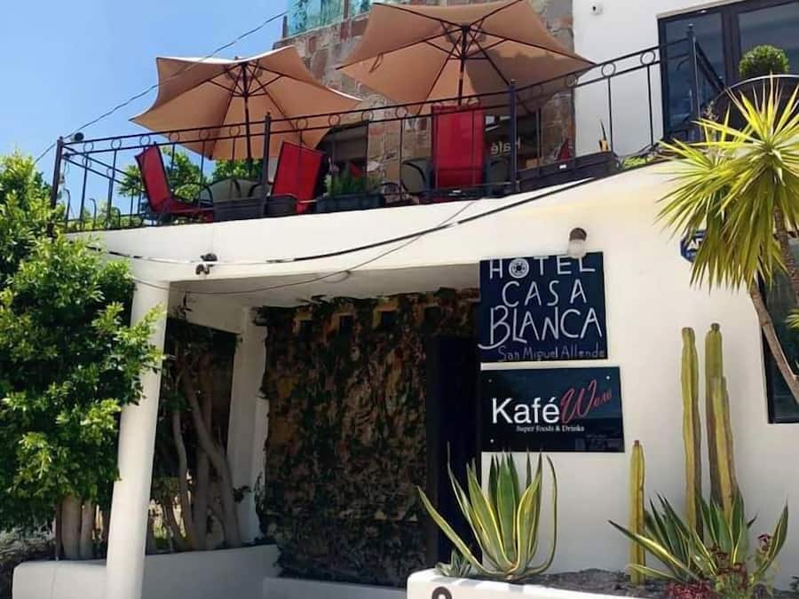 A hotel named 'Hotel Casa Blanca' with outdoor seating and a café.