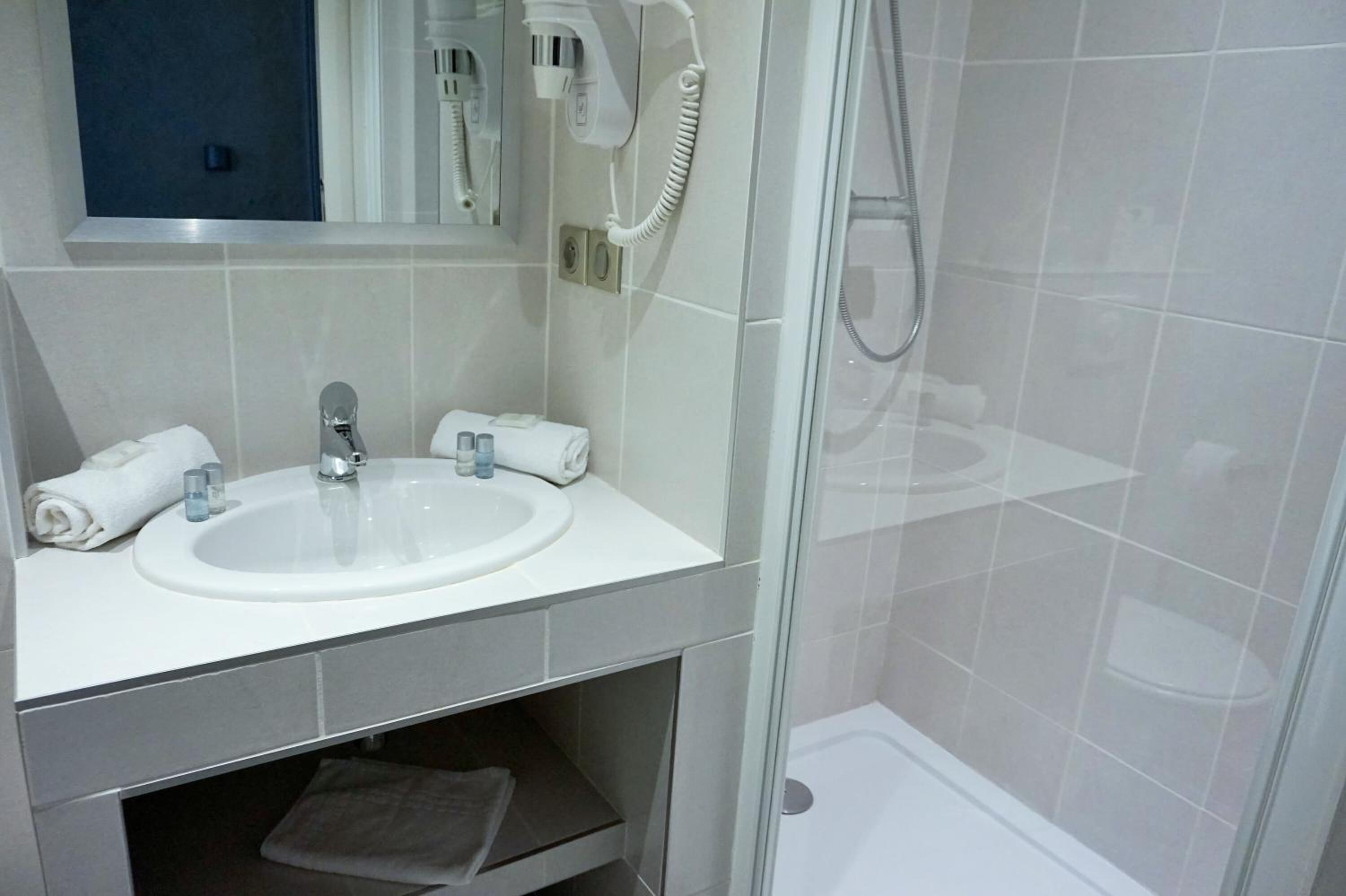 shower, free toiletries, hair dryer, towels