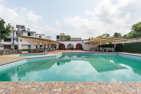 Outdoor pool. OYO Hotel Casa Blanca