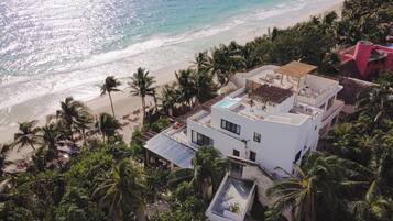 On the beach, white sand, free beach cabanas, sun loungers