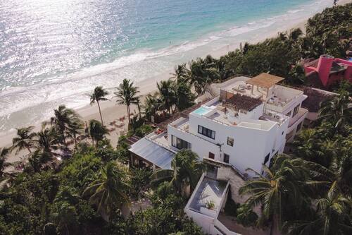 On the beach, white sand, free beach cabanas, sun-loungers