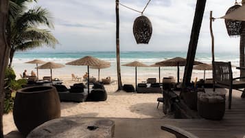 On the beach, white sand, free beach cabanas, sun-loungers