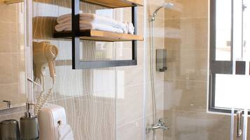 Standard Quadruple Room, 2 Double Beds | Bathroom | Shower, hair dryer, slippers