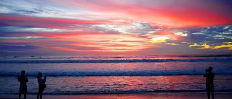 A beach scene with a sunset.
