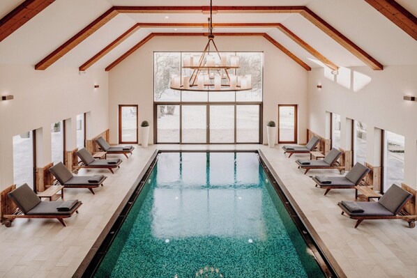 Indoor pool, pool umbrellas, sun loungers