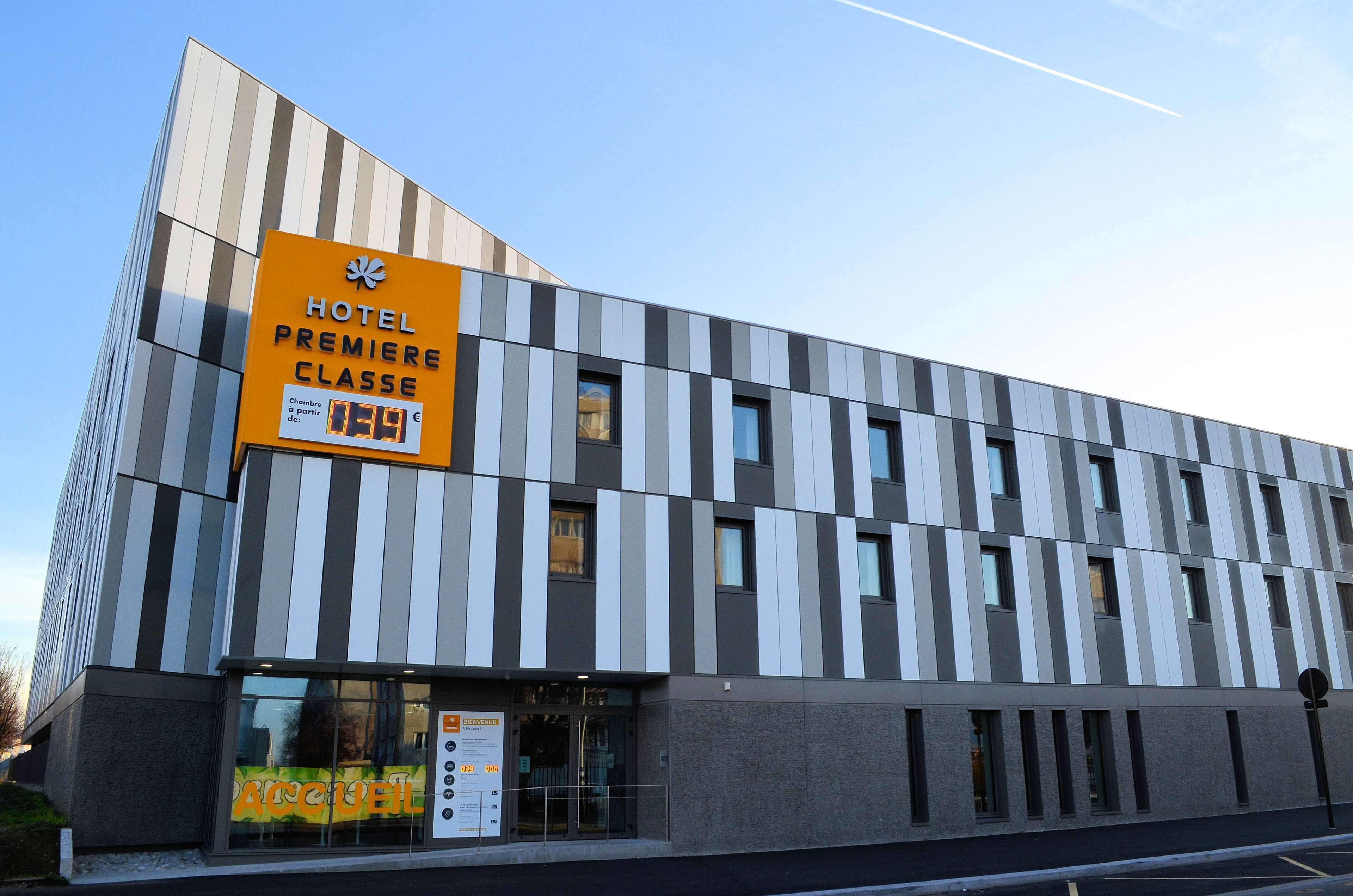 A modern hotel building with a sign indicating it is the first class.