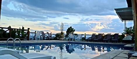 Outdoor pool, pool umbrellas, sun loungers