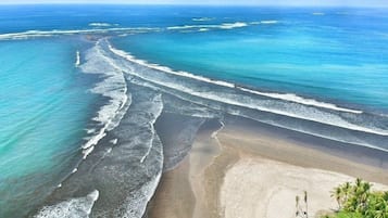 Beach nearby, white sand, beach towels