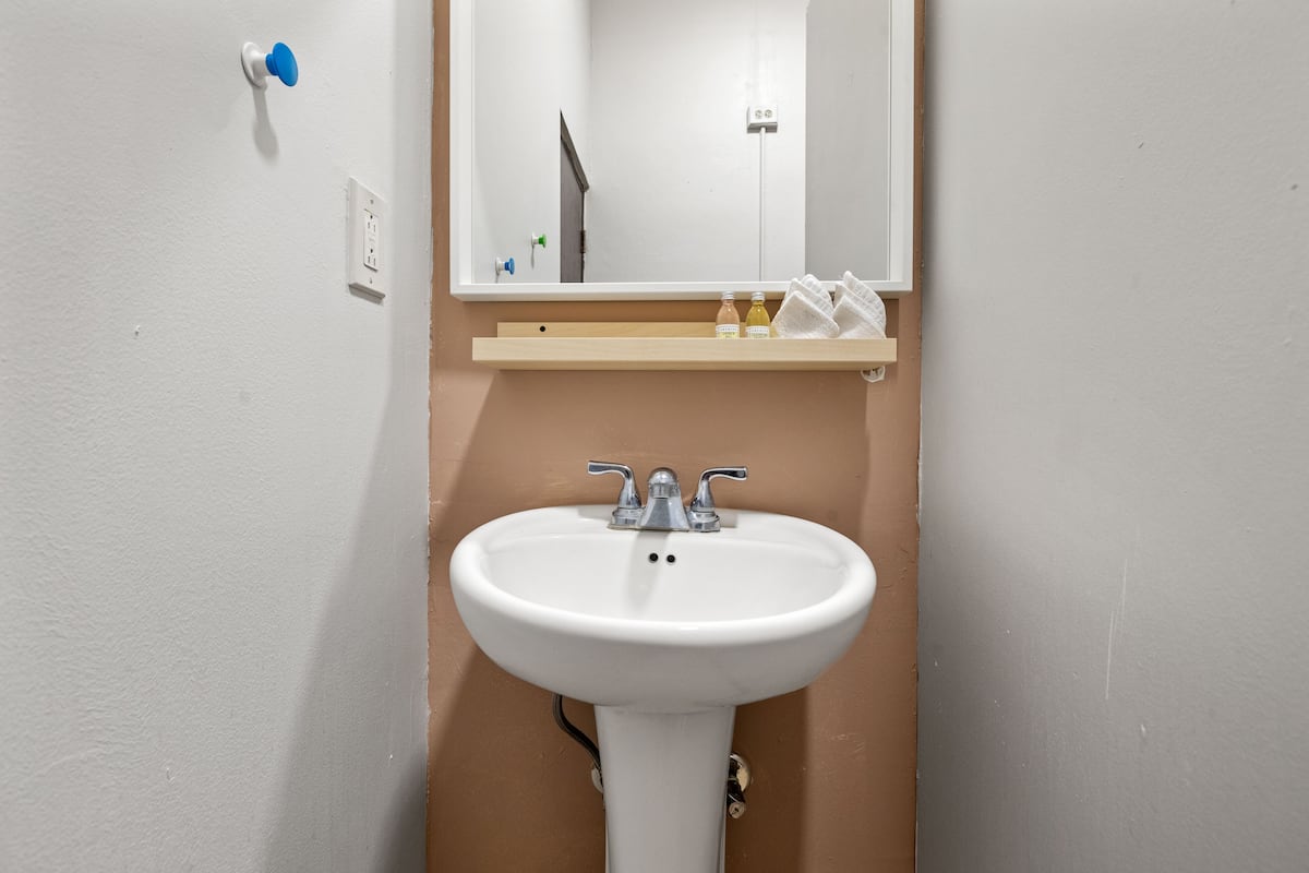 family studio suite, 2 queen beds, kitchenette | bathroom | shower, free toiletries, hair dryer, towels