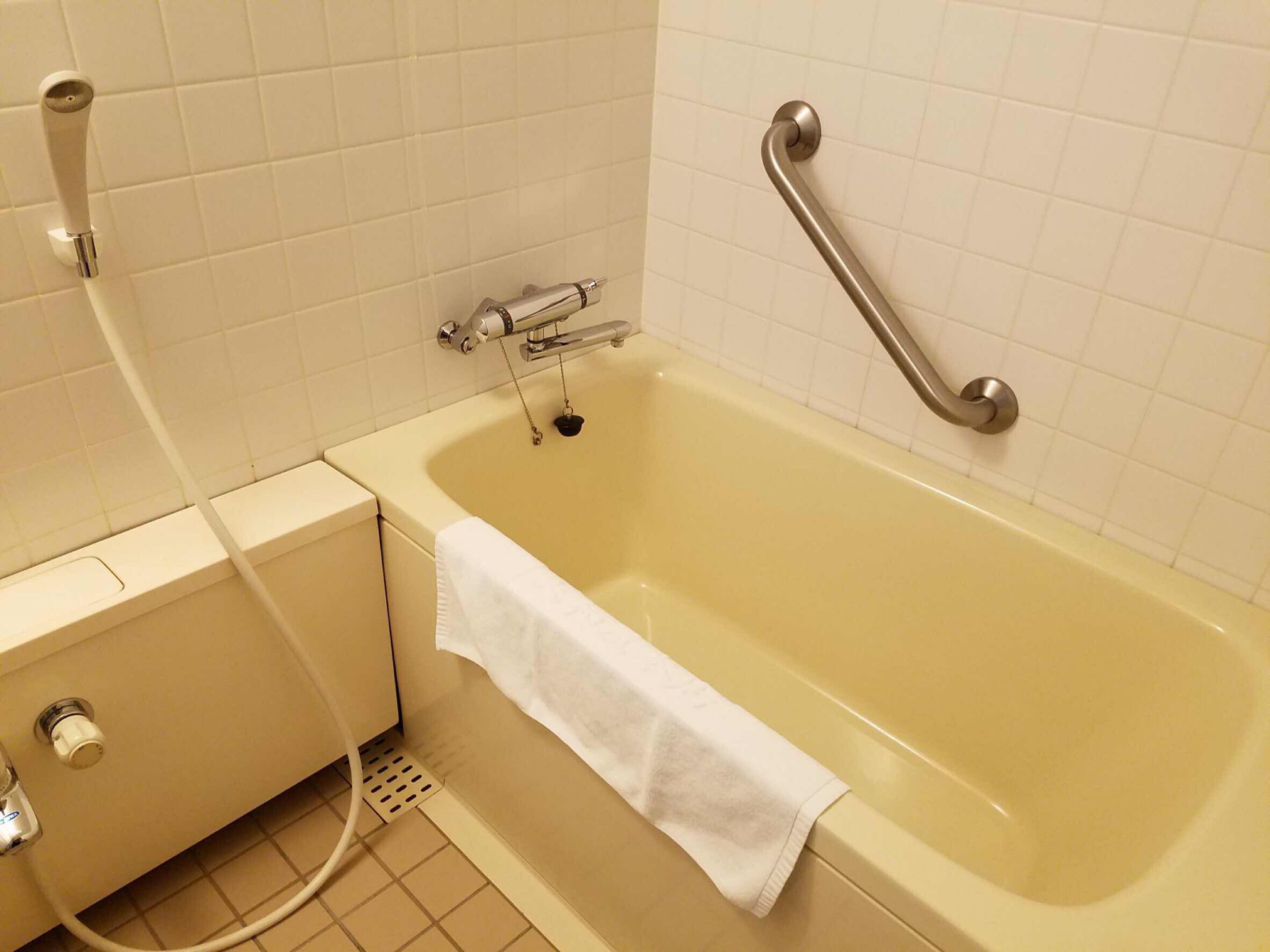 A bathroom with a bathtub, a shower, and a toilet.