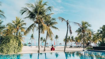 White sand, beach towels